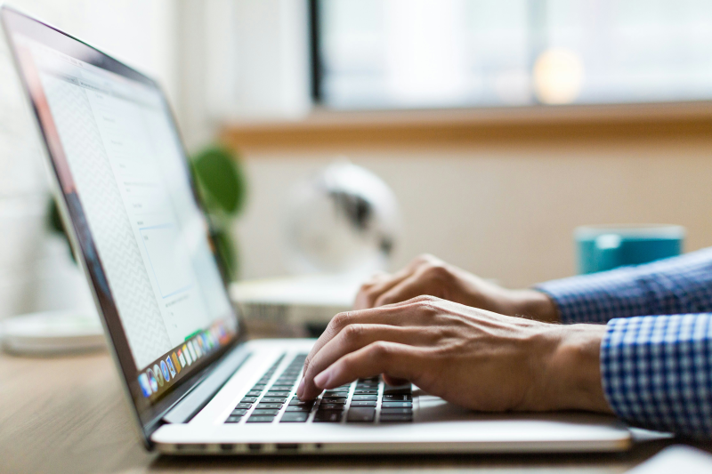 A person typing on a keyboard
